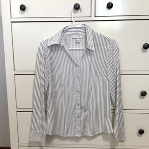 White fitted blouse, black stripes.